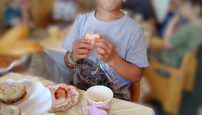 1000014584 Nursery youth enjoying food from our toddler tea party